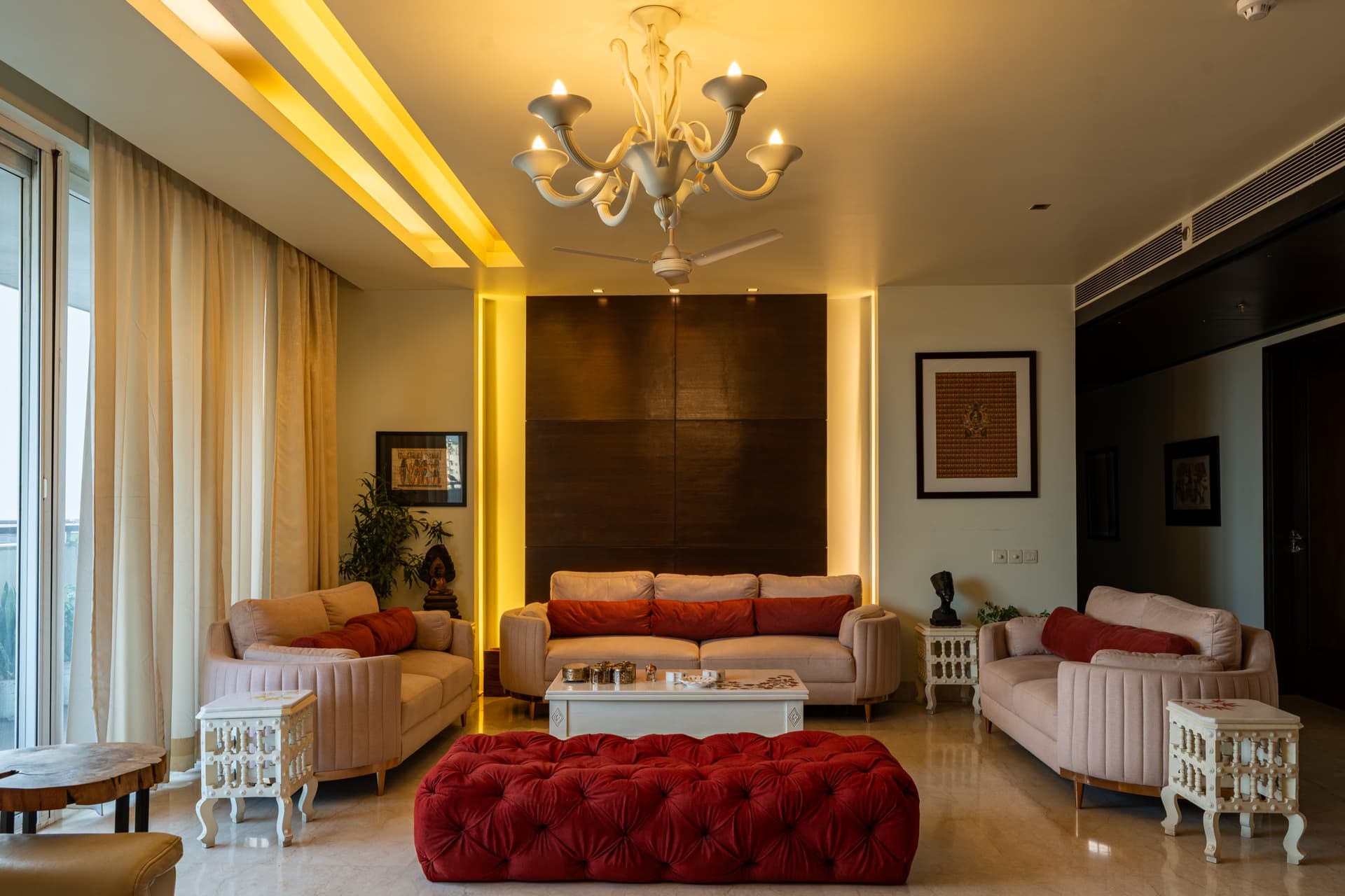 Salcon luxury residence interior living room with chandelier, plush seating and warm ambient lighting